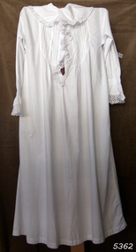 Women's long white nightgown with collar, front opening and lace trim