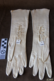 Pair of long white gloves with two button closure at the wrist