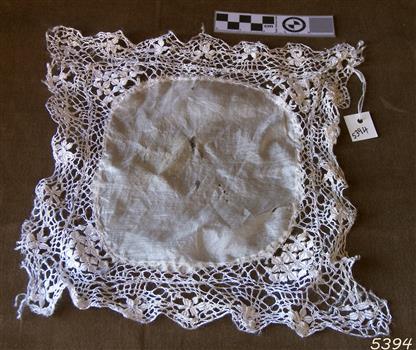 The white handkerchief has a deep lace border