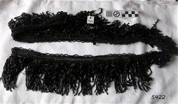Black beaded fringing on a band