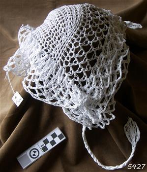 White yarn, knitted hat with chin ties