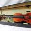 Violin and bow inside a fitted open case
