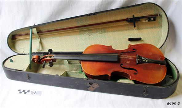 Violin and bow inside a fitted open case