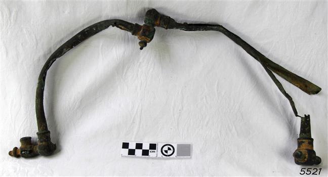 Metal C shaped pipes with fittings at each end, one end of each is joined to the other pipe, forming a U shape
