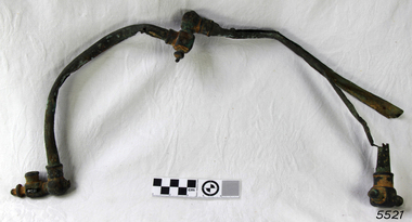 Metal C shaped pipes with fittings at each end, one end of each is joined to the other pipe, forming a U shape