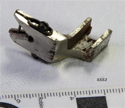 Metal food shaped to fit a sewing machine connection
