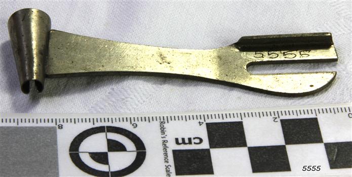 Metal tool has a cone shape at one end