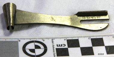 Metal tool has a cone shape at one end