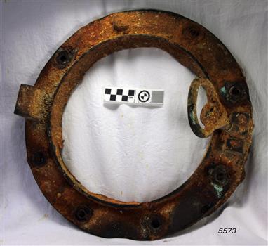 Metal frame has bolt remnants in one of the holes. Its closure is still attached. 