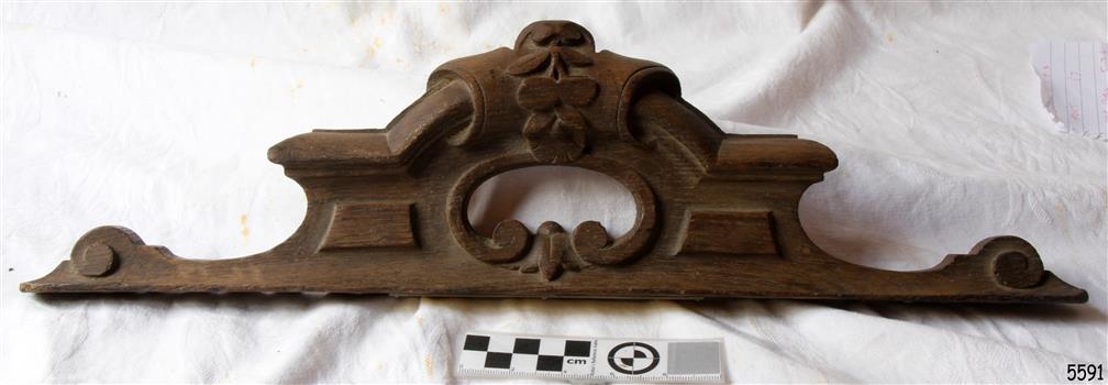 Long and narrow carved wooden headpiece