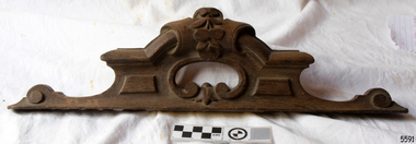 Long and narrow carved wooden headpiece