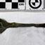Spoon in golden colour covered with black and green marks and sea crustaceans