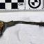Spoon in golden colour covered with black and green marks and sea crustaceans