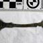 Spoon in golden colour covered with black and green marks and sea crustaceans