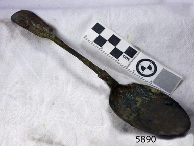 Spoon has been damaged from exposure to sea water