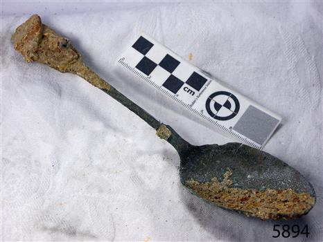 Spoon has encrustation from time under the sea