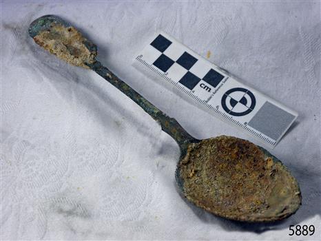 Spoon is damaged and surface has degration and encrustations
