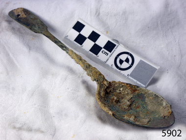 Spoon is covered by a layer of encrustations from the seabed