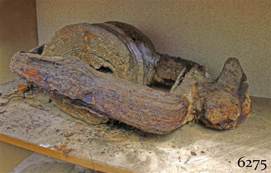 Ship's wooden pulley block, which is aged and coroding