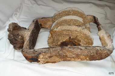 Twin-sheaved wooden block with concretion from the seabed