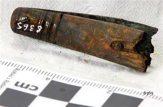 Enclosed end section of a pocket knife; blade section has broken off