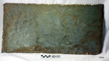 Tile is blue-green-grey coloured and has a rippled texture