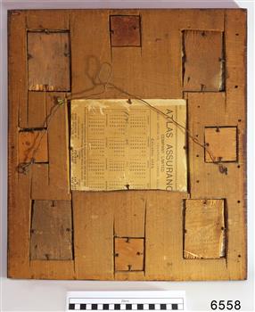 Wooden frame made from several pieces, with a portion of a 1904 calendar included