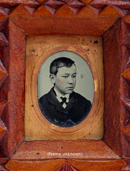 Portrait of a young male with shirt, tie and jacket