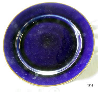 Round blue ceramic plate with a gold rim