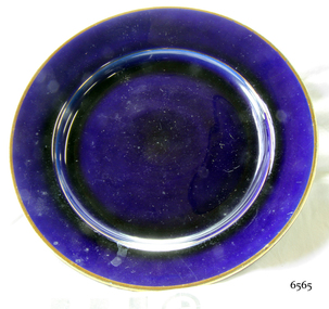 Round blue ceramic plate with a gold rim