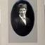 Black and white photograph mounted on card with oval cut-out