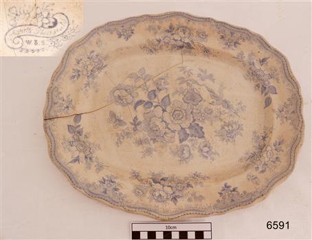 White oval plate with scalloped edge and blue floral design 