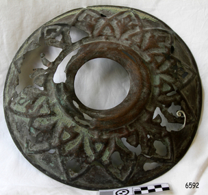 Metal ceiling rose has fancy patterned metal work