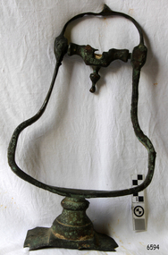 Metal bell-shaped frame with fittings for attaching it to other objects