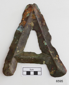 Brass letter "A" with a devilled shape that peaks in the centre