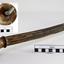 Brass pipe with ribbed surface is attached to a decorative dome