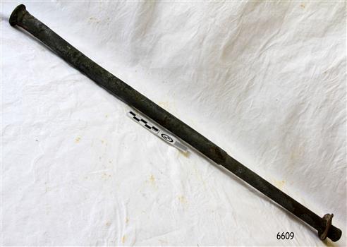 Metal rod with one half wide in diameter that the other. It has a rounded head one end a d a washer at the other.