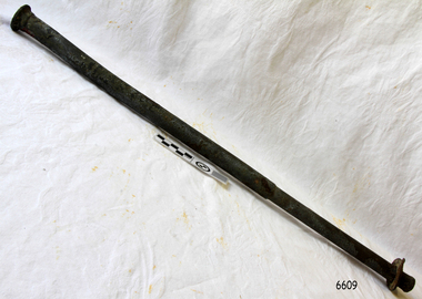 Metal rod with one half wide in diameter that the other. It has a rounded head one end a d a washer at the other.