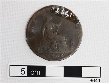 Reverse shows seated woman holding a trident