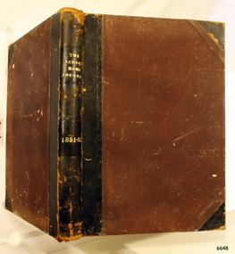 Brown hardcover, leather bound and leather reinforced corners, gold embossed lettering on spine