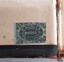 Green label with floral border and text between two oval outline shapes