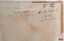 Inscription in black pen has been crossed out and another written in blue pen
