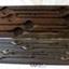 Wooden box with fitted compartments containing metal tools
