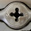 Centre of metal tool has an inscription