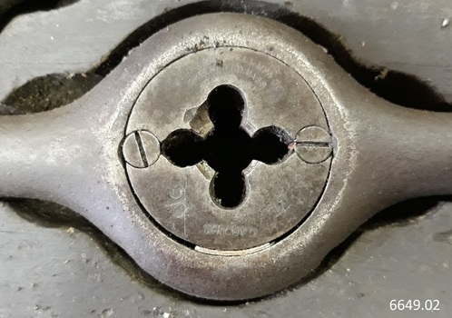 Inscriptions impressed into metal of tools