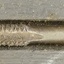 Inscription on flat square end and edge is shaped for cutting