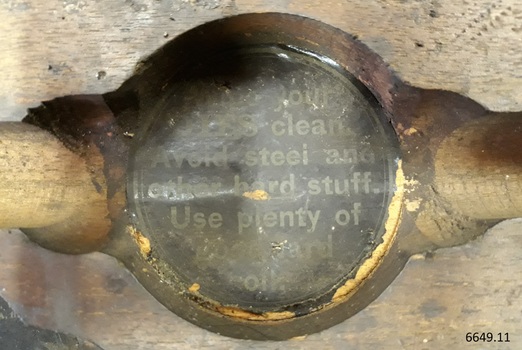Black label inside a compartment has instructions
