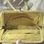 Evening bag has has white silky fabric lining