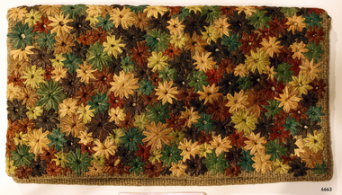 Hopsack wallet is embroidered with coloured raffia flowers
