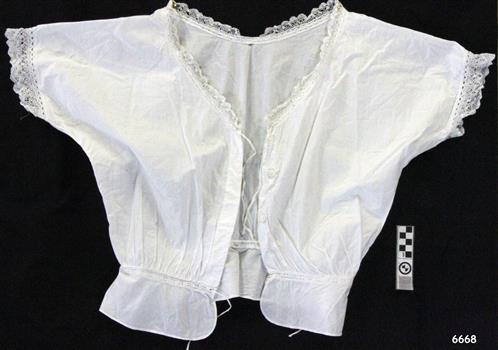 White cotton short sleeved camisole with lace trim and drawstring peplum waist